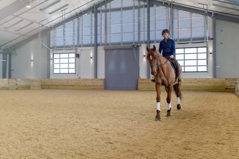 Hannah Schofield rides her horse Merry in the brand new indoor arena at the Equine Medical Center.