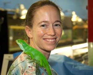 Lauren Howard (DVM '00) with iguana