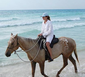Krista Magnifico (DVM '05) riding a horse