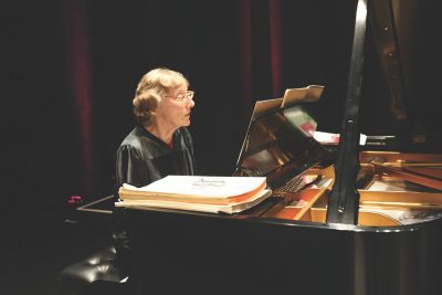 Marion Ehrich plays the piano at graduation
