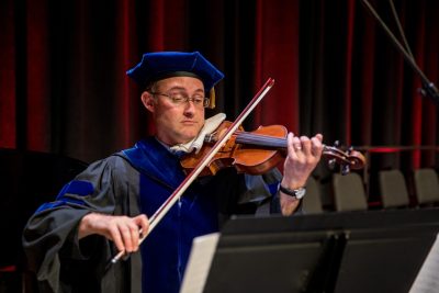 Tom Cecere playing the violin at the 2022 DVM Commencement.