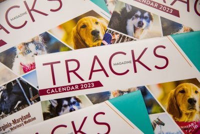 Copies of the 2023 'Tracks' calendar laying out on a table.