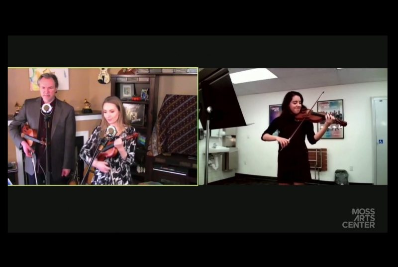 A screenshot taken of an online master class session, showing Mark and Maggie O'Connor watching Virginia Tech student Julia Villegas perform on her fiddle.