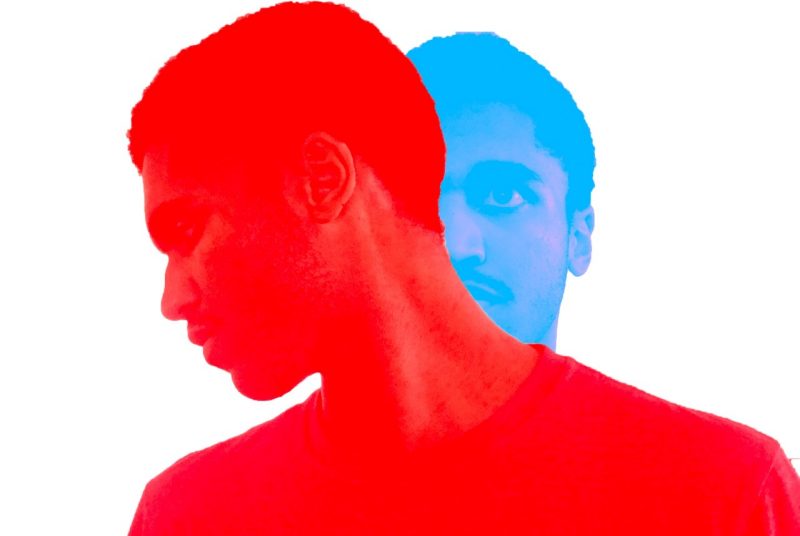 In this digital artwork, two images of men are overlayed - the bottom layer shows half a man's face, blue-hued, looking from behind a man's face in front of that is red-hued.