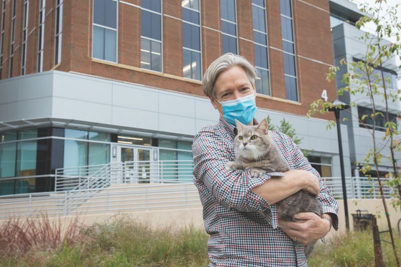 Peter Haberkorn and his cat, Kokomo, stand before the Animal Cancer Care and Research Center in Roanoke, Virginia
