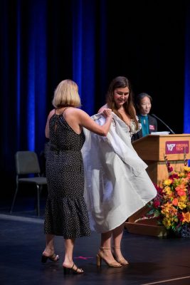 DVM student being coated at the 2026 White Coat Ceremony.