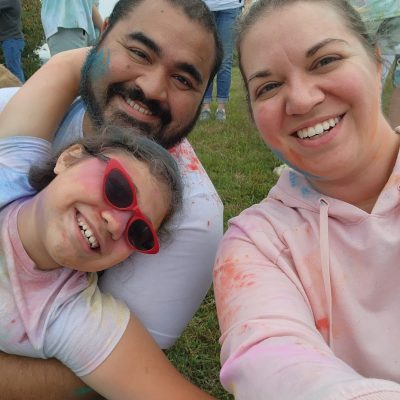Family selfie at a color run.
