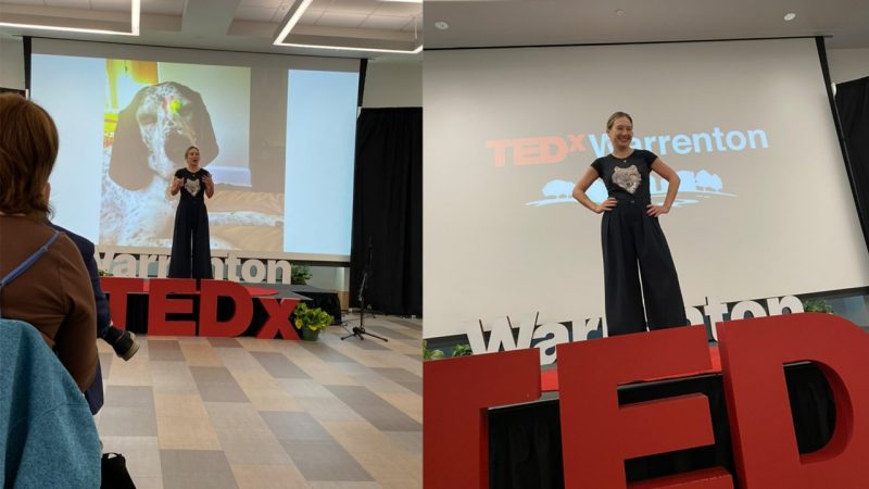 Person speaking during a TEDx talk.