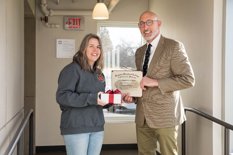 Dean Dan Givens presents the February 2023 Staff Member of the Month award to Teresa Williams.